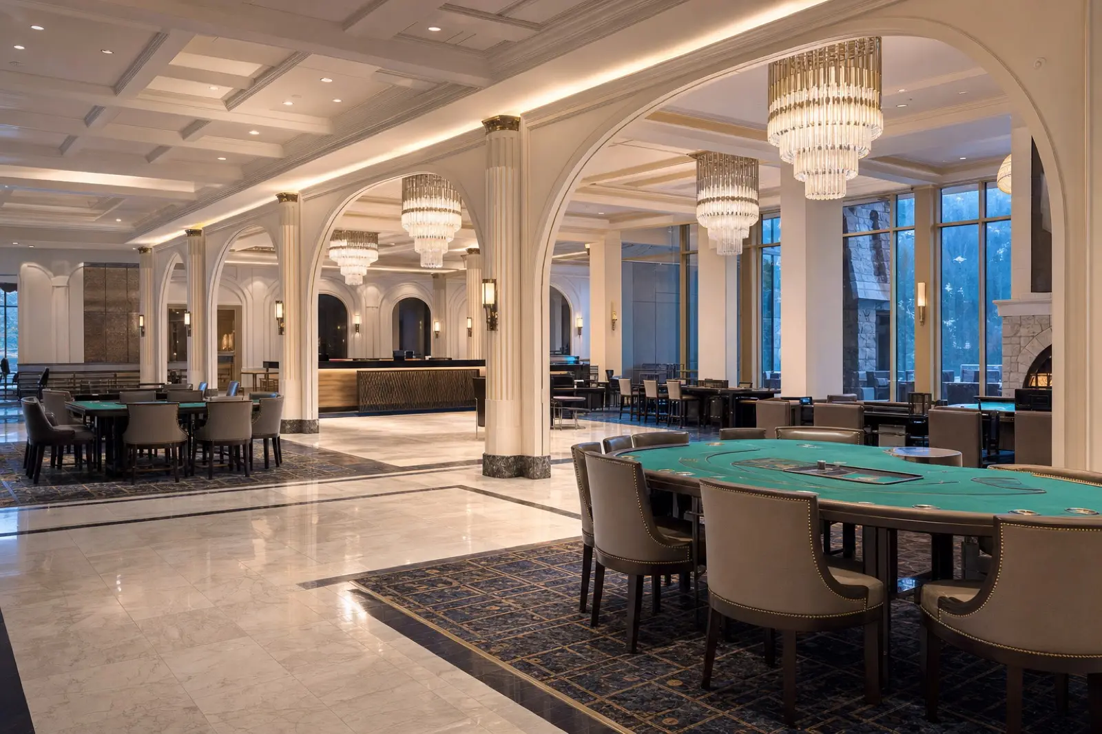 Empty elegant gaming floor with table games and warm lighting
